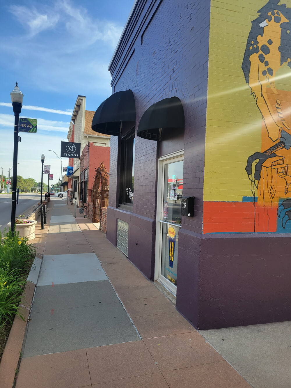 Colorful mural on a historic storefront corner in the Uni Place neighborhood of Lincoln, NE