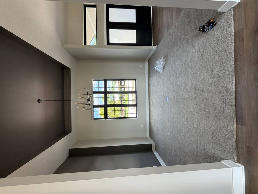 Dining room with a dark bronze painted tray ceiling