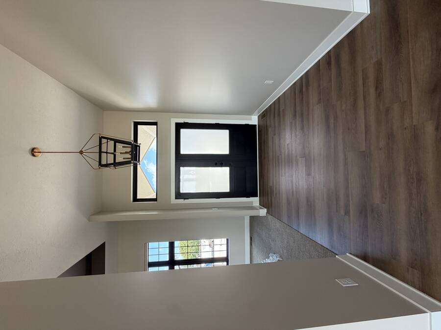 Upstairs landing with painted accent wall and matching railing